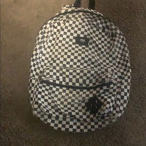 This is a black and white vans backpack